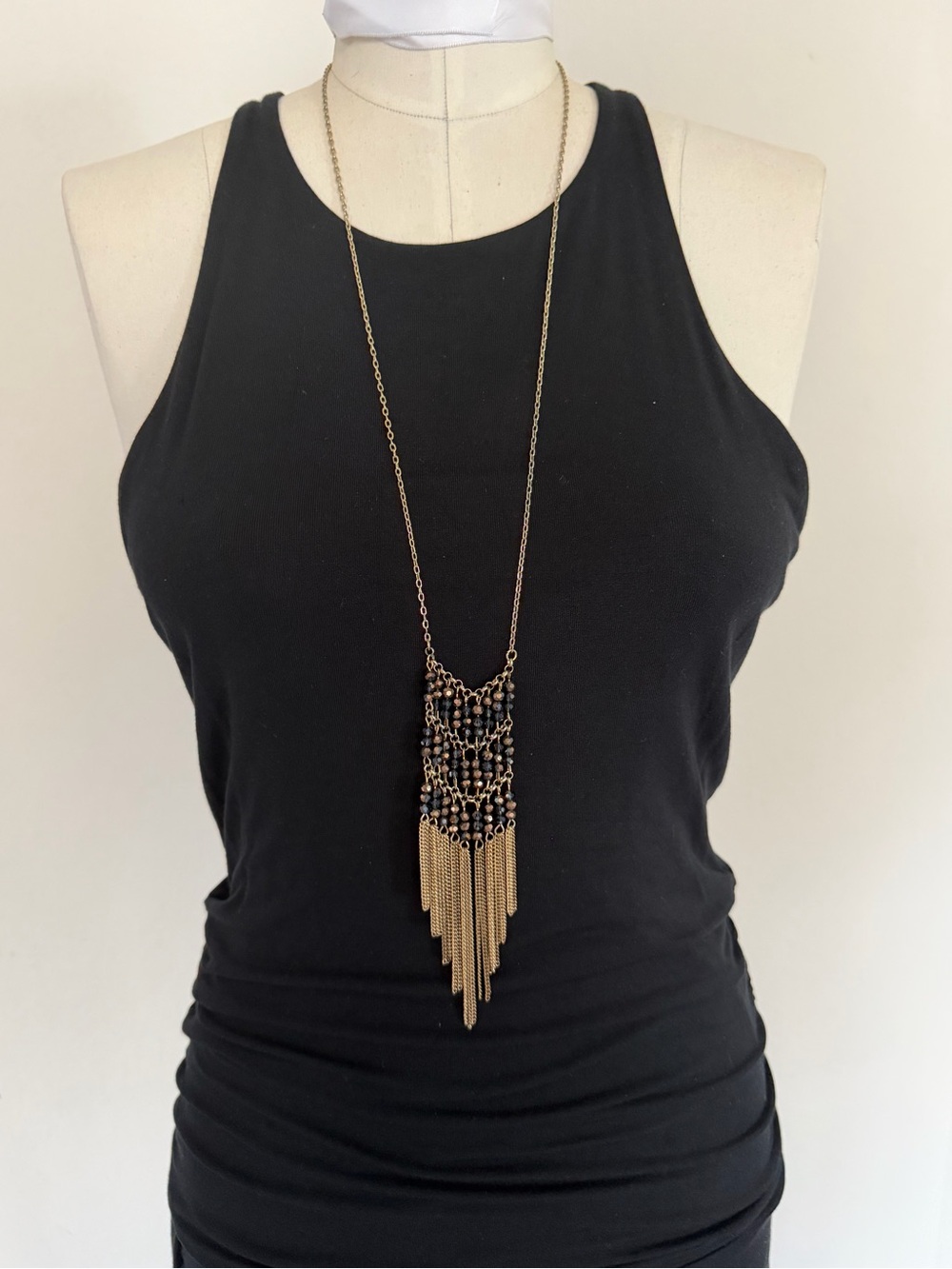 Long elegant gold toned necklace